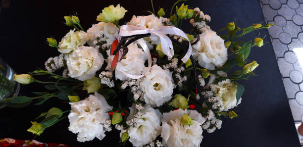 istock bouquet of white chinese roses 1267859411