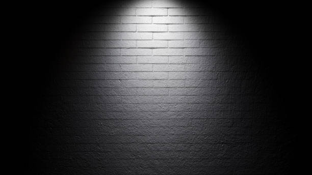 istock Bright spotlight illuminate dark brick wall 1267859735