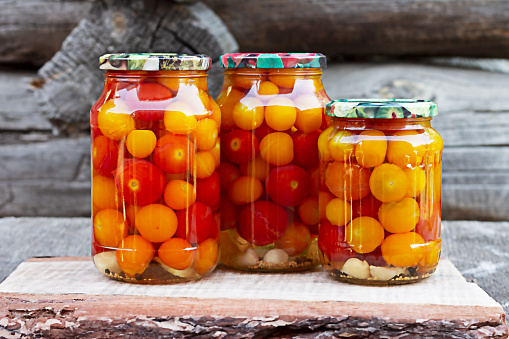 Tomatoes in a glass jar, homemade pickles