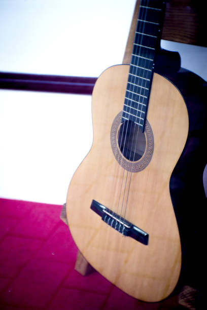 istock Spanish guitar musical instrument perched on a tripod. No people 1267866603