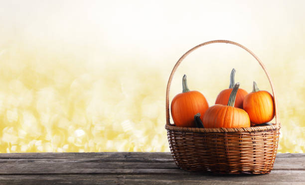 istock Little pumpkins in basket 1267892040