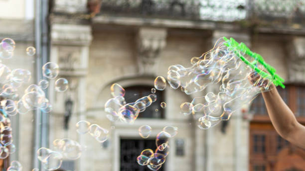 istock Street artist making soap bubbles. 1267902668