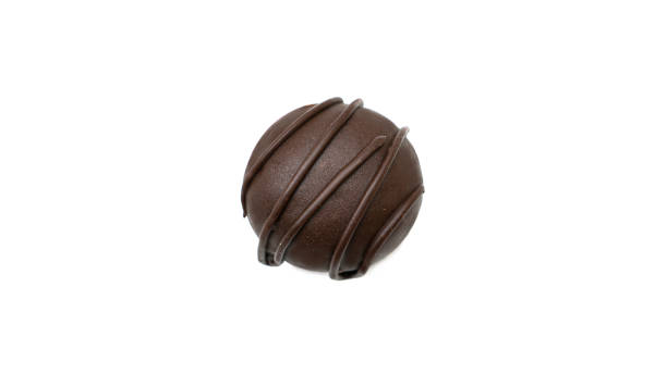 istock Delicious, round, chocolate candy with nuts on a white background 1267927259