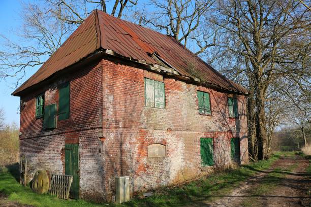 istock Old weathered small brick house in a park 1267929561