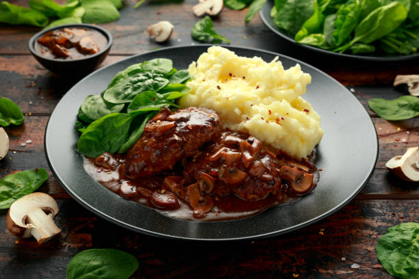 istock Salisbury Steak with mushroom gravy, mashed potatoes and spinach 1267929733