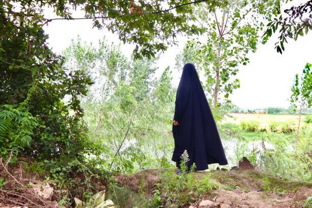 istock Alone Muslim woman walking in the jungle 1267930020