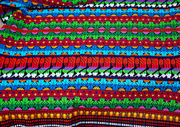 istock Traditional mayan textile pattern with bright colors and figurines, Antigua Guatemala 1267930723