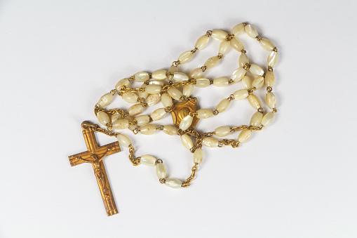 Traditional catholic rosary in gold and pearls