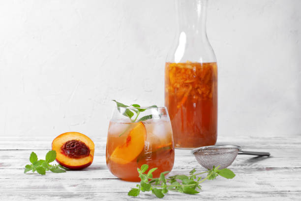 istock Iced tea with nectarines topped with mint in glass 1267931790