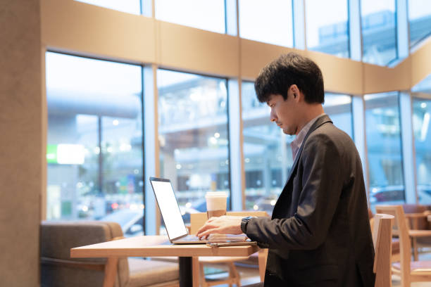 istock businessman think of online project looking at laptop at workplace 1267932346