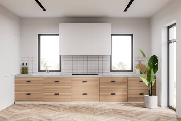 istock White kitchen interior with wooden countertop 1267933710