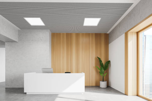 istock Reception desk in white and wooden office 1267933955