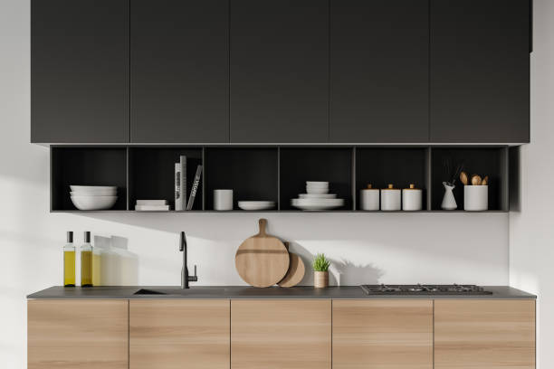 istock Wooden cabinets in white kitchen interior 1267934045
