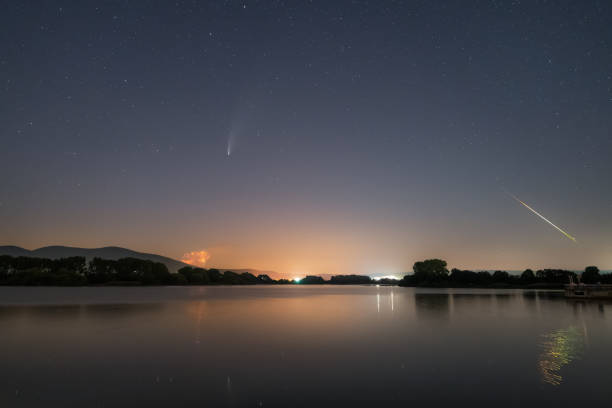 istock Comet and meteor over the lake 1267934069