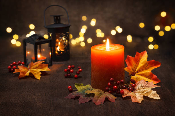 istock Autumn candle over wooden background. 1267935082