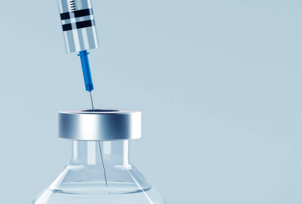 istock Corona virus vaccine development with syringe and ampoule 1267935300