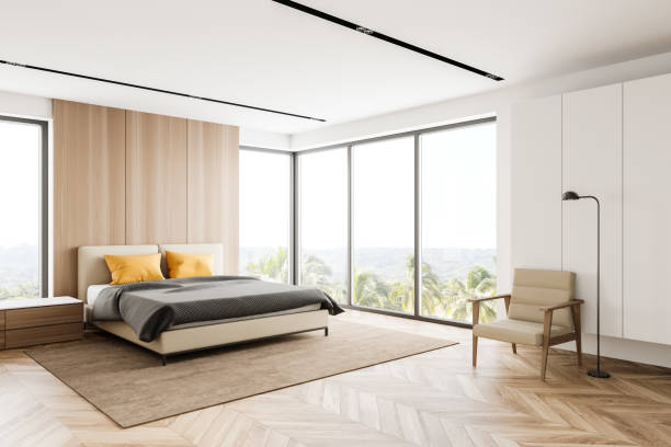 istock White and wooden bedroom corner with armchair 1267936310