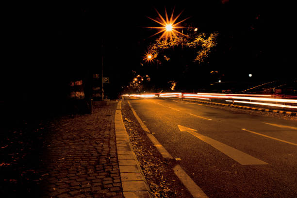 istock light trails on an empty street in the night 1267938973