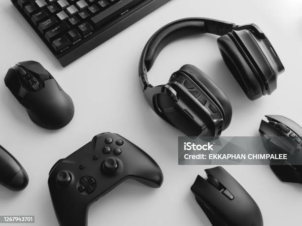 Gamer Work Space Concept Top View A Gaming Gear Mouse Keyboard Joystick Headset Mobile Joystick In Ear Headphone And Mouse Pad On Black Table Background Stock Photo - Download Image Now