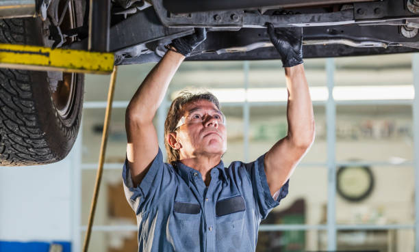 istock Senior Hispanic man working in auto repair shop 1267943739