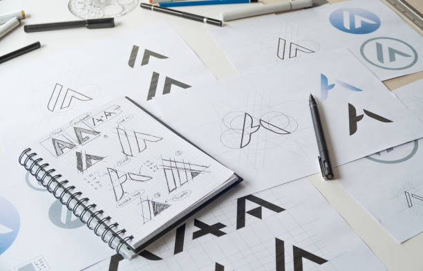 istock Graphic designer creative design sketch drawing logo Trademark brand Workspace 1267954114