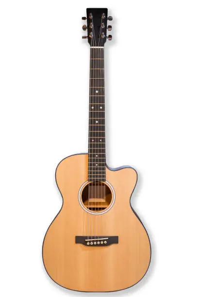 Photo of Acoustic cutaway guitar isolated over white background.