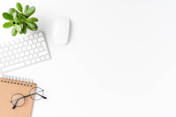 istock Elegant workspace with business accessories isolated on white background with copyspace. Office desktop 1267970589