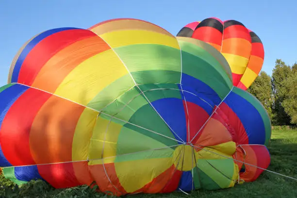 Inflation preparation on the ground of a multicolored hot air balloon