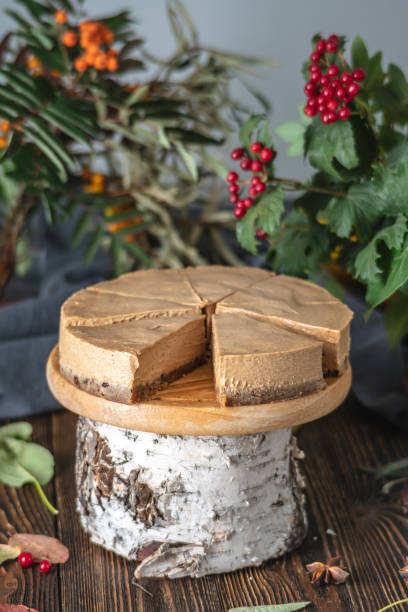 istock Brown mousse cake without decorations cutted into pieces. Rustic style. Concept of autumn mood and atmosphere 1267992137