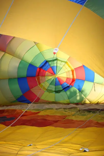 inflation preparation of a hot air balloon on the ground, seen inside