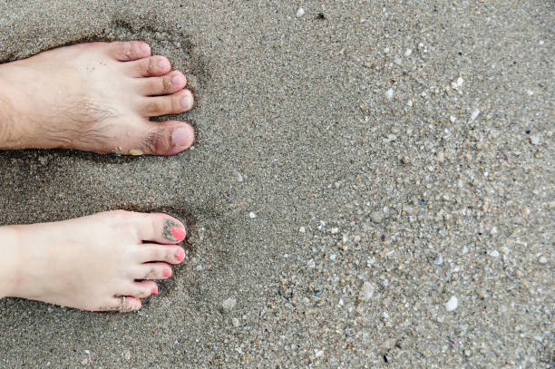 istock stand together on sand, abstract photograph, background, couple 1267994821