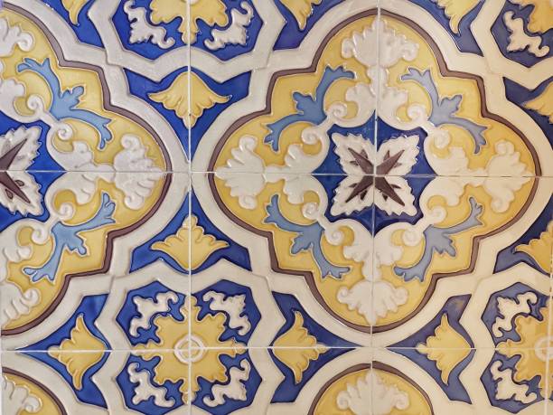 istock Spanish tile on wall, blue and yellow tile 1267995371