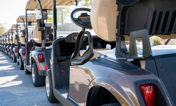 background image of multiple golf carts parked in order. - pista de aeroporto imagens e fotografias de stock
