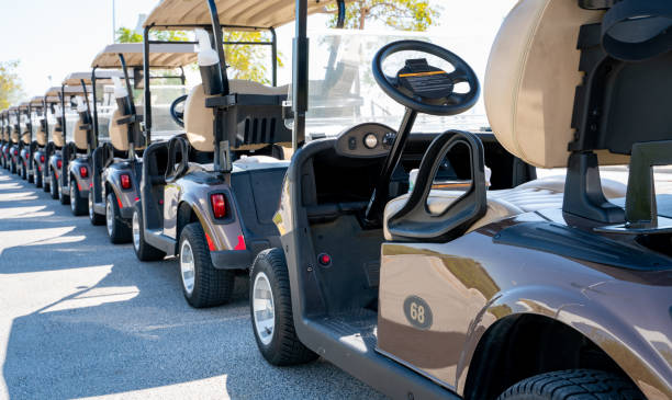 istock Background image of multiple golf carts parked in order. 1267996645
