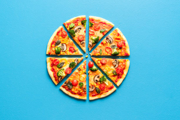 istock Pizza primavera slices top view. Vegetarian pizza flat lay. Sliced pizza. 1267996781