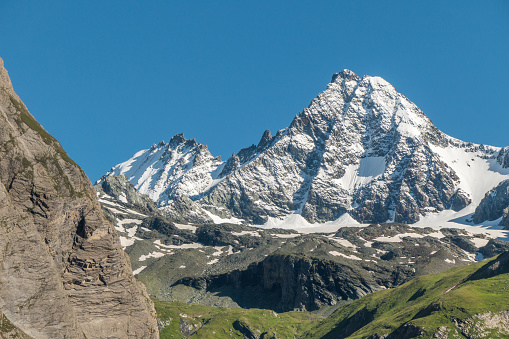 This photo was taken in the Ködnitztal near the Lückner mountain hut.\nThe Grossglockner is Austria’s highest mountain and centrepiece of the High Tauern National Park. The “black mountain” rises 3,798 m above a sea of three hundred 3,000 m peaks surrounding it.
