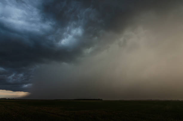 istock thunderstorm clouds with heavy rain in summer 1267997310
