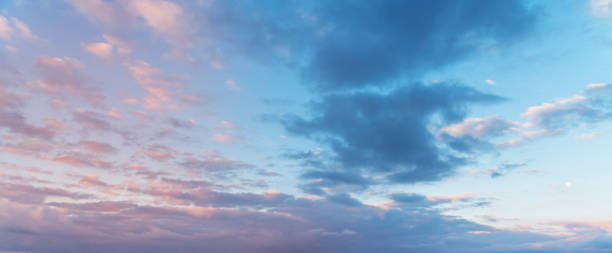 istock Beautiful sunrise sky with dramatic blue clouds. Nature background. 1267999778
