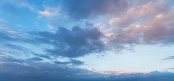 istock Beautiful sunrise sky with dramatic blue clouds. Nature background. 1268000166
