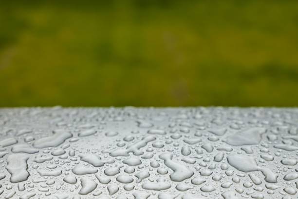 Beautiful background texture of rain water drops on grey black metal surface. Beautiful backgrounds.