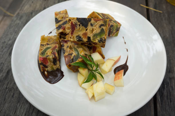 istock delicious sliced fruit cake with mixed fruit on wooden table 1268018530