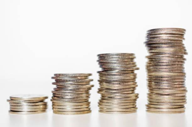istock silver coin stack growth up isolated on white background with clipping path. money saving, financial grow, business startup, economy budget and investment concept. 1268019476