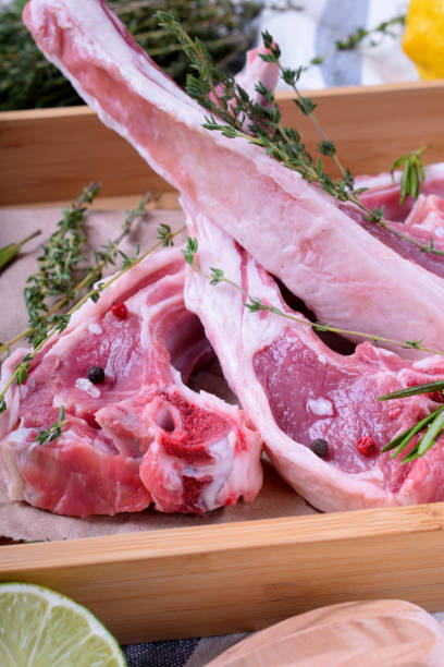 istock Raw lamb ribs, spices and herbs on parchment 1268019635