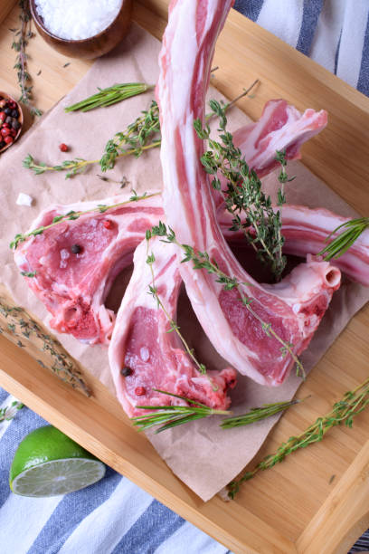 istock Raw lamb ribs, spices and herbs on parchment 1268019644