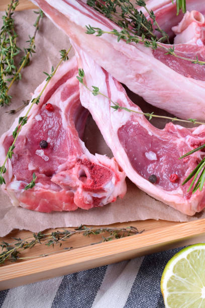 istock Raw lamb ribs, spices and herbs on parchment 1268019664