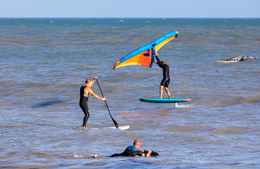Eastbourne, UK - Aug 21, 2020. A windsurfer sufing in a beach of Eastbourne of East Sussex.