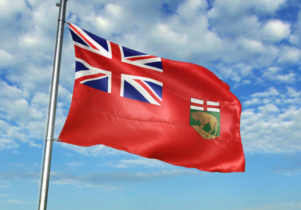 istock Manitoba of Canada flag waving with sky on background 1268019847