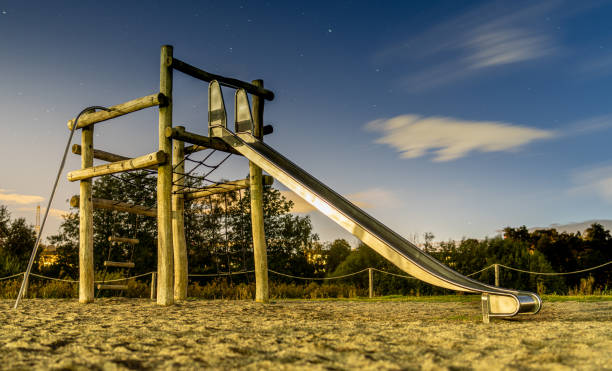Metal slide on a wooden structure