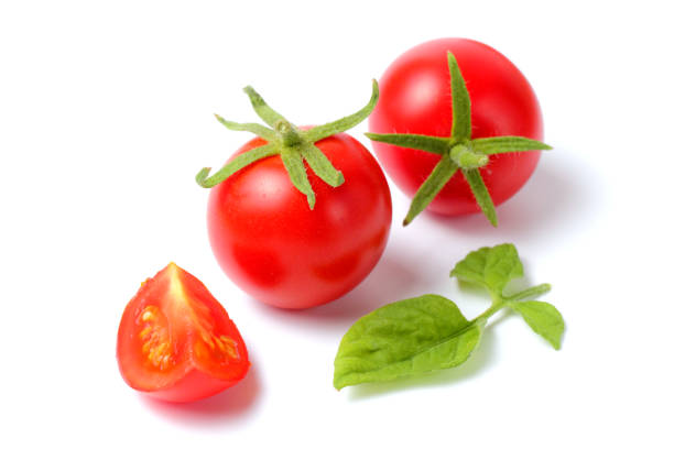 istock Fresh organic tomato with halves on a white background, bright natural color, 1268024745