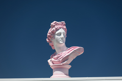 Modern conceptual art colorful ancient statue of bust of Apollo. Collage of contemporary art style
